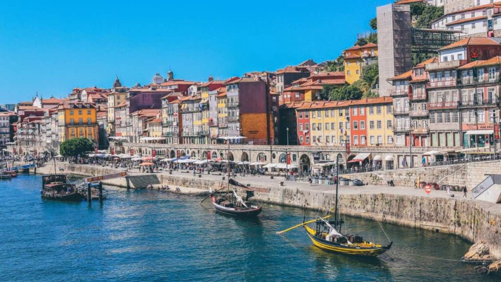 Travel solo with a peaceful view of small boats next to the port in Porto