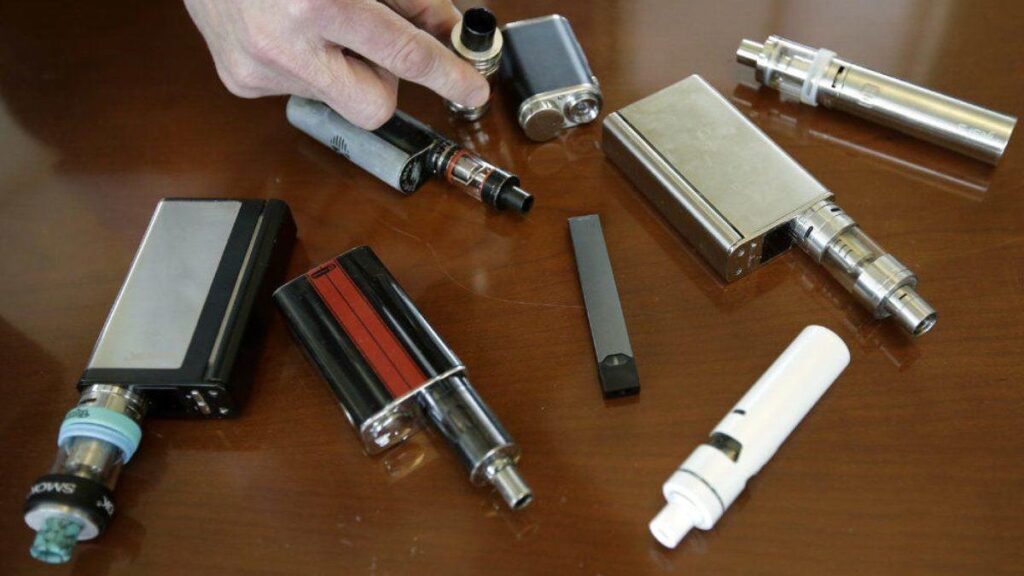 Different types of e-cigarettes displayed on a table