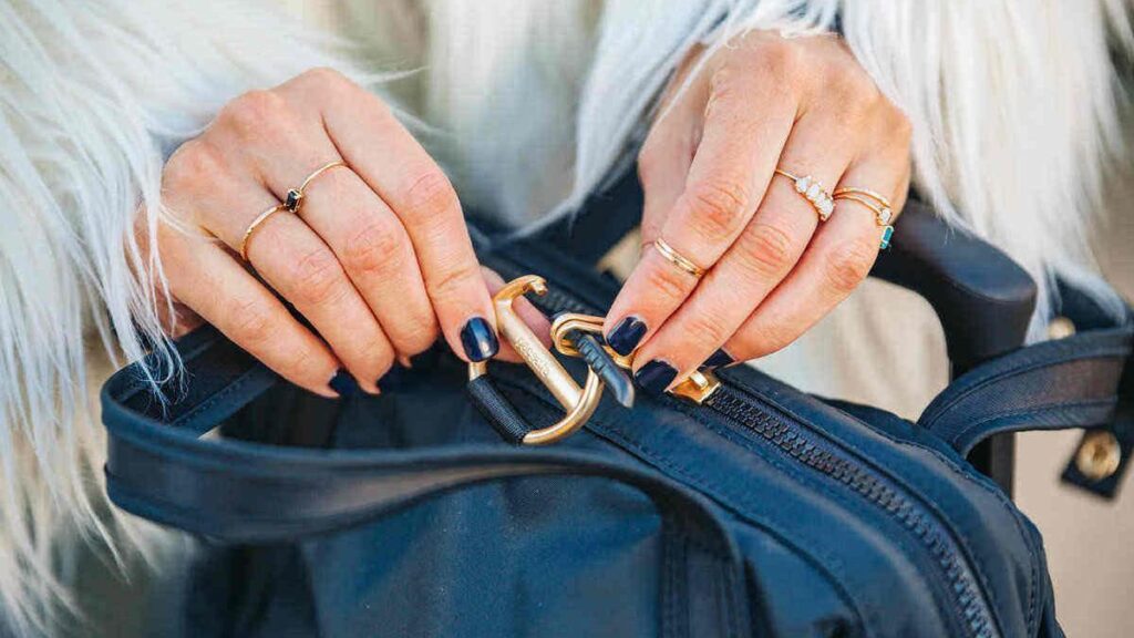 Woman locking up her hand bag