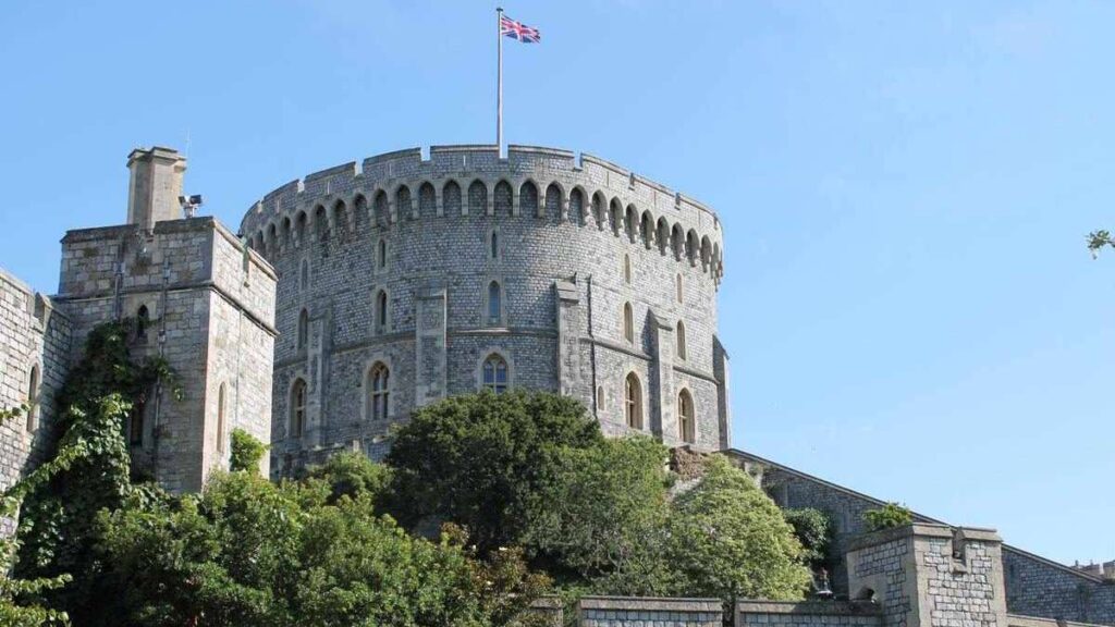 Famous castle, view of Windsor Castle with the British flag