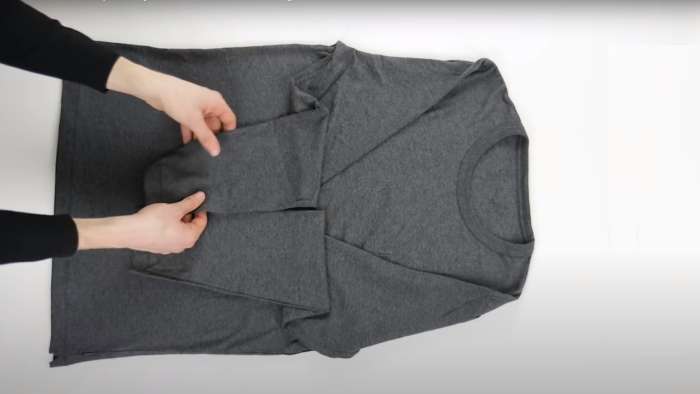 How to pack clothes - How to roll long-sleeved shirts, step 2