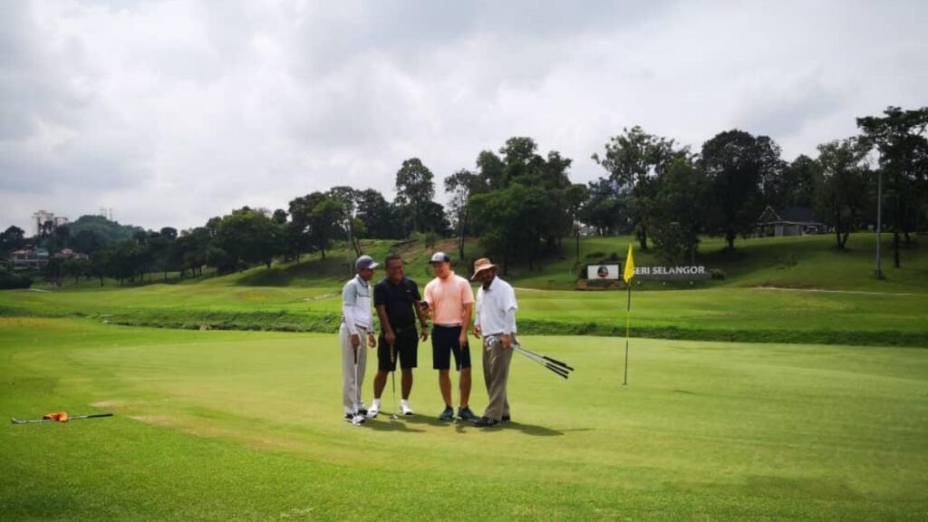Golfers using Deemples in Malaysia. Playing golf
